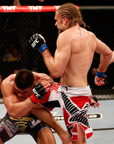 SAO PAULO, BRAZIL - JANUARY 19: (R-L) Andrew Craig delivers a flying knee against Ronny Markes in their middleweight fight at the UFC on FX event on January 19, 2013 at Ibirapuera Gymnasium in Sao Paulo, Brazil. (Photo by Josh Hedges/Zuffa LLC/Zuffa LLC via Getty Images)