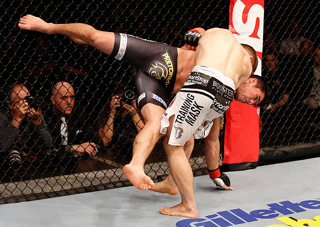 SAO PAULO, BRAZIL - JANUARY 19: Nik Lentz (white shorts) takes down Diego Nunes in their featherweight fight at the UFC on FX event on January 19, 2013 at Ibirapuera Gymnasium in Sao Paulo, Brazil. (Photo by Josh Hedges/Zuffa LLC/Zuffa LLC via Getty Images)
