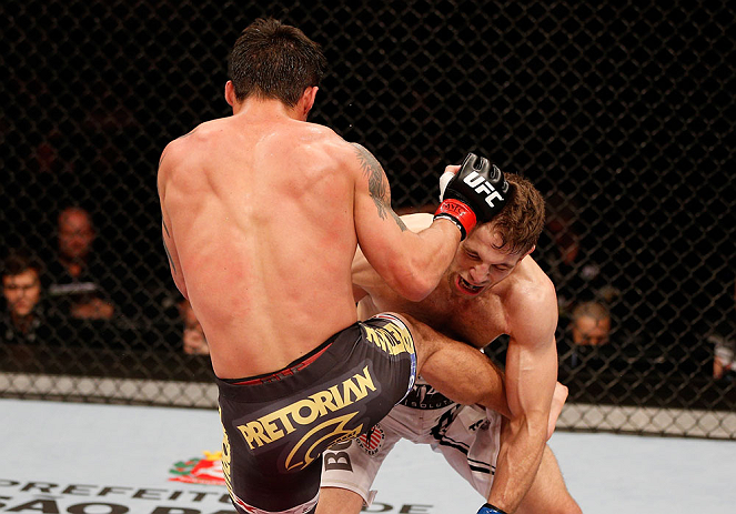 SAO PAULO, BRAZIL - JANUARY 19: (L-R) Diego Nunes kicks Nik Lentz in their featherweight fight at the UFC on FX event on January 19, 2013 at Ibirapuera Gymnasium in Sao Paulo, Brazil. (Photo by Josh Hedges/Zuffa LLC/Zuffa LLC via Getty Images)