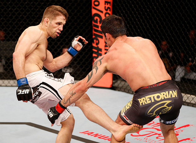 SAO PAULO, BRAZIL - JANUARY 19: (L-R) Nik Lentz kicks Diego Nunes in their featherweight fight at the UFC on FX event on January 19, 2013 at Ibirapuera Gymnasium in Sao Paulo, Brazil. (Photo by Josh Hedges/Zuffa LLC/Zuffa LLC via Getty Images)