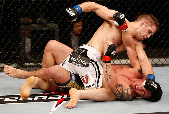 SAO PAULO, BRAZIL - JANUARY 19: Nik Lentz (white shorts) punches Diego Nunes in their featherweight fight at the UFC on FX event on January 19, 2013 at Ibirapuera Gymnasium in Sao Paulo, Brazil. (Photo by Josh Hedges/Zuffa LLC/Zuffa LLC via Getty Images)