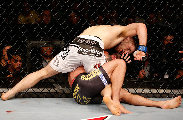 SAO PAULO, BRAZIL - JANUARY 19: Nik Lentz (white shorts) punches Diego Nunes in their featherweight fight at the UFC on FX event on January 19, 2013 at Ibirapuera Gymnasium in Sao Paulo, Brazil. (Photo by Josh Hedges/Zuffa LLC/Zuffa LLC via Getty Images)
