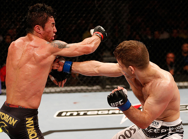SAO PAULO, BRAZIL - JANUARY 19: (R-L) Nik Lentz and Diego Nunes trade punches in their featherweight fight at the UFC on FX event on January 19, 2013 at Ibirapuera Gymnasium in Sao Paulo, Brazil. (Photo by Josh Hedges/Zuffa LLC/Zuffa LLC via Getty Images)