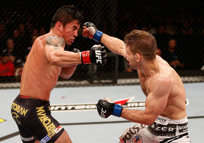 SAO PAULO, BRAZIL - JANUARY 19: (R-L) Nik Lentz and Diego Nunes trade punches in their featherweight fight at the UFC on FX event on January 19, 2013 at Ibirapuera Gymnasium in Sao Paulo, Brazil. (Photo by Josh Hedges/Zuffa LLC/Zuffa LLC via Getty Images)