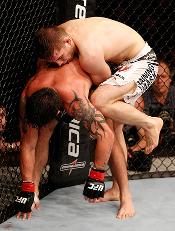 SAO PAULO, BRAZIL - JANUARY 19: (R-L) Nik Lentz knees Diego Nunes in their featherweight fight at the UFC on FX event on January 19, 2013 at Ibirapuera Gymnasium in Sao Paulo, Brazil. (Photo by Josh Hedges/Zuffa LLC/Zuffa LLC via Getty Images)