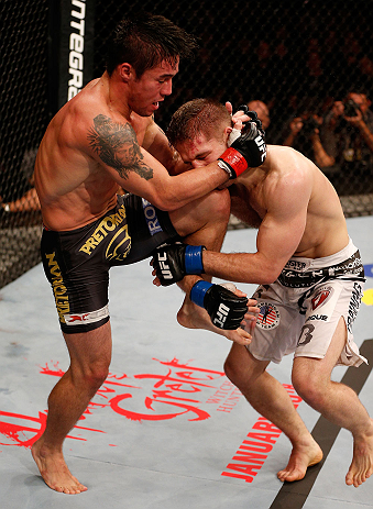 SAO PAULO, BRAZIL - JANUARY 19: (L-R) Diego Nunes knees Nik Lentz in their featherweight fight at the UFC on FX event on January 19, 2013 at Ibirapuera Gymnasium in Sao Paulo, Brazil. (Photo by Josh Hedges/Zuffa LLC/Zuffa LLC via Getty Images)