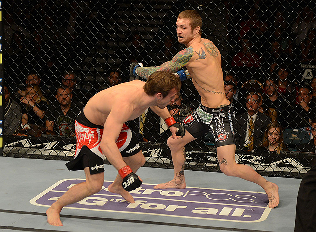 LAS VEGAS, NV - DECEMBER 29:  (R-L) Eddie Wineland punches Brad Pickett during their bantamweight fight at UFC 155 on December 29, 2012 at MGM Grand Garden Arena in Las Vegas, Nevada. (Photo by Donald Miralle/Zuffa LLC/Zuffa LLC via Getty Images) *** Local Caption *** Brad Pickett; Eddie Wineland