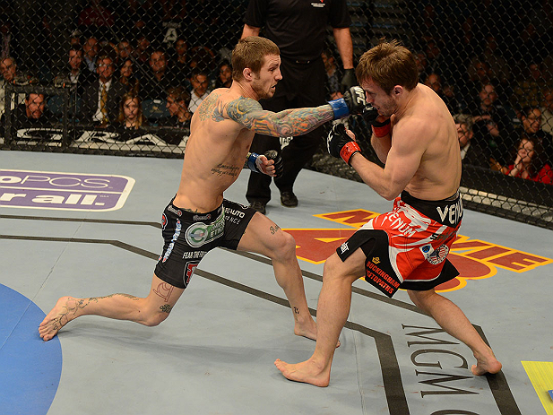LAS VEGAS, NV - DECEMBER 29:  (L-R) Eddie Wineland punches Brad Pickett during their bantamweight fight at UFC 155 on December 29, 2012 at MGM Grand Garden Arena in Las Vegas, Nevada. (Photo by Donald Miralle/Zuffa LLC/Zuffa LLC via Getty Images) *** Local Caption *** Brad Pickett; Eddie Wineland