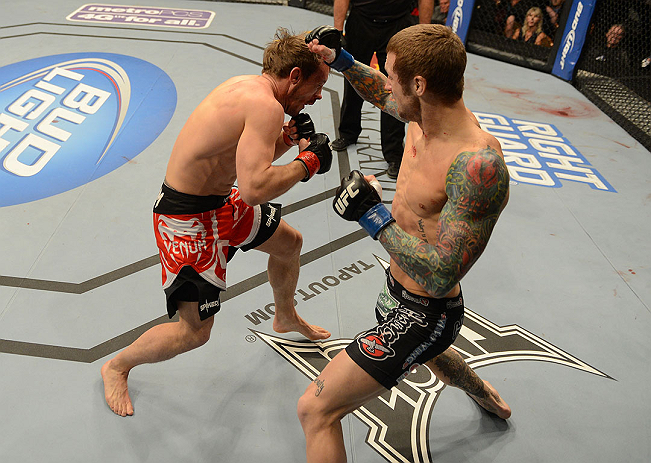 LAS VEGAS, NV - DECEMBER 29:  (R-L) Eddie Wineland punches Brad Pickett during their bantamweight fight at UFC 155 on December 29, 2012 at MGM Grand Garden Arena in Las Vegas, Nevada. (Photo by Donald Miralle/Zuffa LLC/Zuffa LLC via Getty Images) *** Local Caption *** Brad Pickett; Eddie Wineland