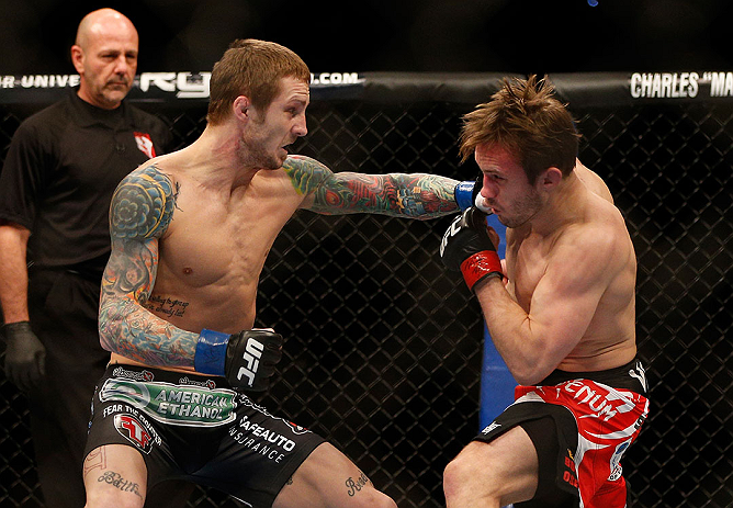 LAS VEGAS, NV - DECEMBER 29:  (L-R) Eddie Wineland punches Brad Pickett during their bantamweight fight at UFC 155 on December 29, 2012 at MGM Grand Garden Arena in Las Vegas, Nevada. (Photo by Josh Hedges/Zuffa LLC/Zuffa LLC via Getty Images) *** Local Caption *** Brad Pickett; Eddie Wineland