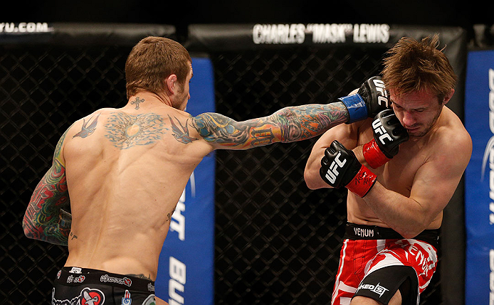 LAS VEGAS, NV - DECEMBER 29:  (L-R) Eddie Wineland punches Brad Pickett during their bantamweight fight at UFC 155 on December 29, 2012 at MGM Grand Garden Arena in Las Vegas, Nevada. (Photo by Josh Hedges/Zuffa LLC/Zuffa LLC via Getty Images) *** Local Caption *** Brad Pickett; Eddie Wineland