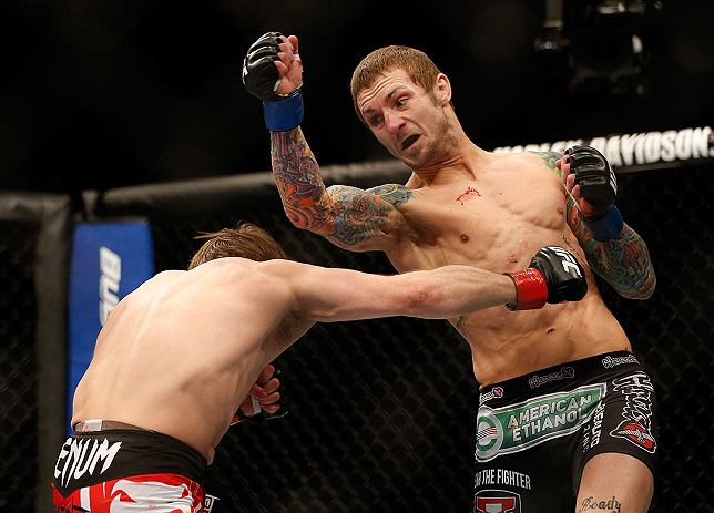 LAS VEGAS, NV - DECEMBER 29:  (R-L) Eddie Wineland punches Brad Pickett during their bantamweight fight at UFC 155 on December 29, 2012 at MGM Grand Garden Arena in Las Vegas, Nevada. (Photo by Josh Hedges/Zuffa LLC/Zuffa LLC via Getty Images) *** Local Caption *** Brad Pickett; Eddie Wineland