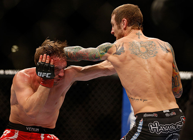 LAS VEGAS, NV - DECEMBER 29:  (R-L) Eddie Wineland punches Brad Pickett during their bantamweight fight at UFC 155 on December 29, 2012 at MGM Grand Garden Arena in Las Vegas, Nevada. (Photo by Josh Hedges/Zuffa LLC/Zuffa LLC via Getty Images) *** Local Caption *** Brad Pickett; Eddie Wineland