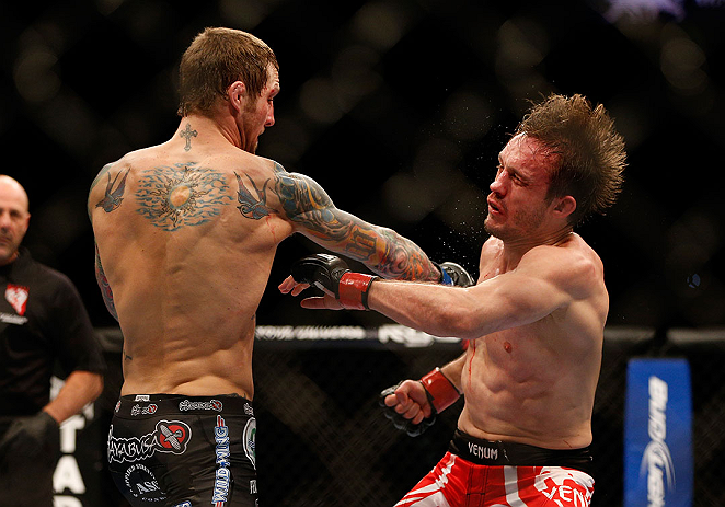 LAS VEGAS, NV - DECEMBER 29:  (L-R) Eddie Wineland punches Brad Pickett during their bantamweight fight at UFC 155 on December 29, 2012 at MGM Grand Garden Arena in Las Vegas, Nevada. (Photo by Josh Hedges/Zuffa LLC/Zuffa LLC via Getty Images) *** Local Caption *** Brad Pickett; Eddie Wineland