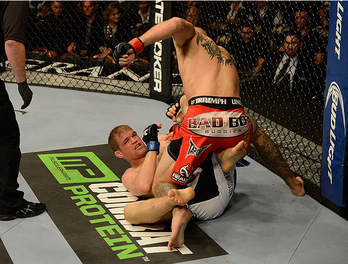 Donald Cerrone punches <a href='../fighter/Evan-Dunham'>Evan Dunham</a> during their bout at UFC 167