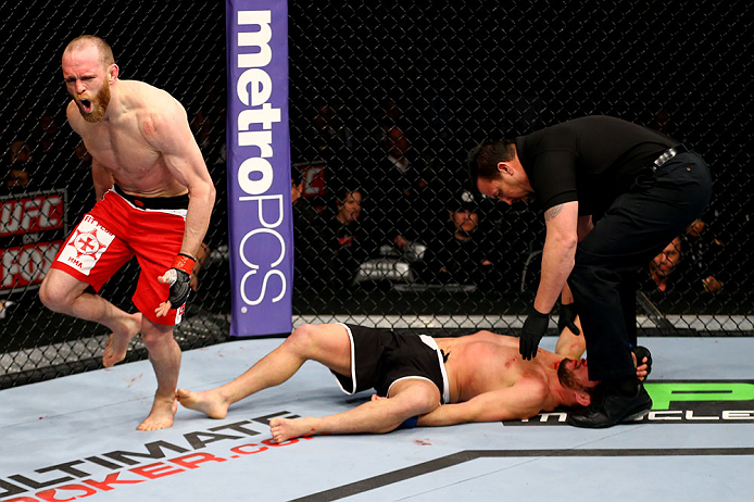 CHICAGO, IL - JANUARY 26:  TJ Grant (L) celebrates after defeating Matt Wiman (R) during their Lightweight Bout part of UFC on FOX at United Center on January 26, 2013 in Chicago, Illinois.  (Photo by Al Bello/Zuffa LLC/Zuffa LLC Via Getty Images)