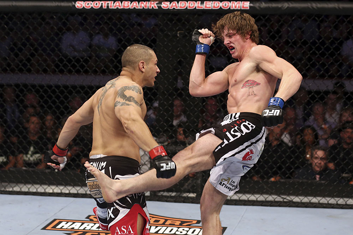 CALGARY, CANADA - JULY 21:  (L-R) Chris Clements takes a kick from Matthew Riddle during their welterweight bout at UFC 149 inside the Scotiabank Saddledome on July 21, 2012 in Calgary, Alberta, Canada.  (Photo by Nick Laham/Zuffa LLC/Zuffa LLC via Getty Images)
