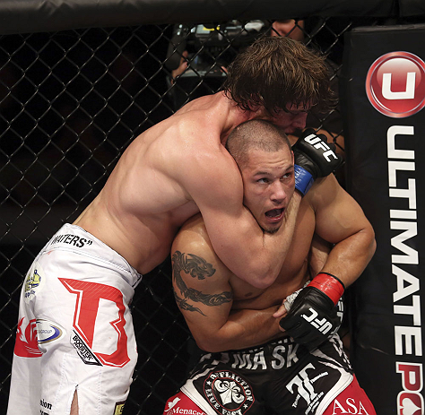 CALGARY, CANADA - JULY 21: (R-L) Chris Clements is caught in a choke hold from Matthew Riddle during their welterweight bout at UFC 149 inside the Scotiabank Saddledome on July 21, 2012 in Calgary, Alberta, Canada.  (Photo by Nick Laham/Zuffa LLC/Zuffa LLC via Getty Images)