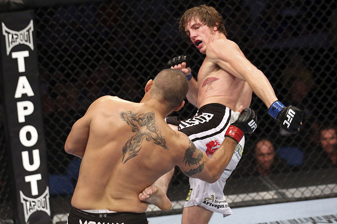 CALGARY, CANADA - JULY 21:  (L-R) Chris Clements takes a kick from Matthew Riddle during their welterweight bout at UFC 149 inside the Scotiabank Saddledome on July 21, 2012 in Calgary, Alberta, Canada.  (Photo by Nick Laham/Zuffa LLC/Zuffa LLC via Getty Images)