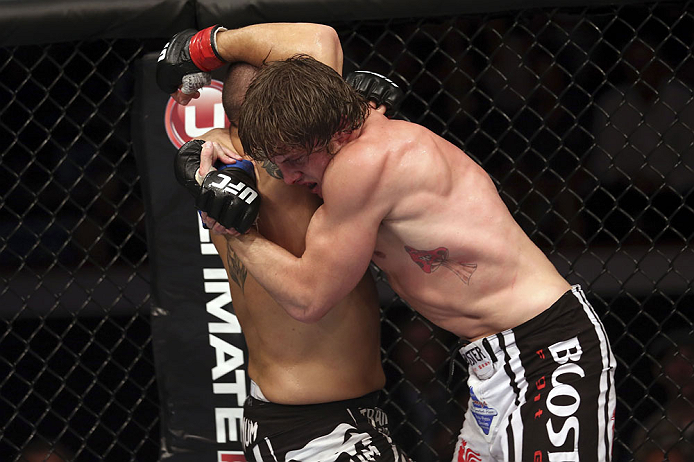 CALGARY, CANADA - JULY 21: (L-R) Chris Clements is caught by Matthew Riddle during their welterweight bout at UFC 149 inside the Scotiabank Saddledome on July 21, 2012 in Calgary, Alberta, Canada.  (Photo by Nick Laham/Zuffa LLC/Zuffa LLC via Getty Images)
