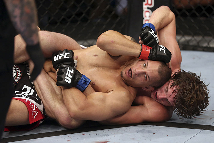CALGARY, CANADA - JULY 21:  Chris Clements is caught on his back by Matthew Riddle during their welterweight bout at UFC 149 inside the Scotiabank Saddledome on July 21, 2012 in Calgary, Alberta, Canada.  (Photo by Nick Laham/Zuffa LLC/Zuffa LLC via Getty Images)