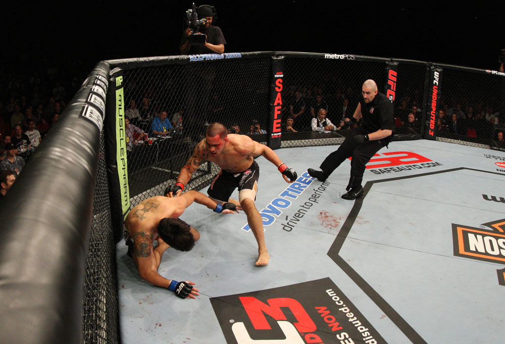 SYDNEY, AUSTRALIA - MARCH 03: (R-L) James Te Huna moves in to finish Aaron Rosa after knocking him down with a punch in a light heavyweight bout during the UFC on FX event at Allphones Arena on March 3, 2012 in Sydney, Australia. (Photo by Josh Hedges/Zuffa LLC/Zuffa LLC via Getty Images) *** Local Caption *** James Te Huna; Aaron Rosa