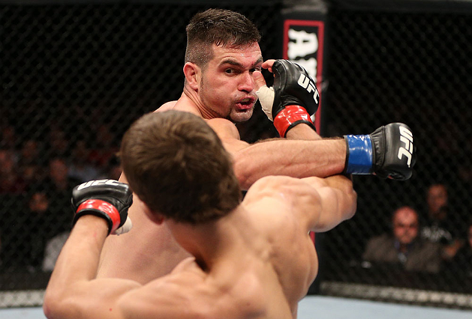 NOTTINGHAM, ENGLAND - SEPTEMBER 29: (R-L) John Maguire punches John Hathaway during their welterweight fight at the UFC on Fuel TV event at Capital FM Arena on September 29, 2012 in Nottingham, England. (Photo by Josh Hedges/Zuffa LLC/Zuffa LLC via Getty Images)