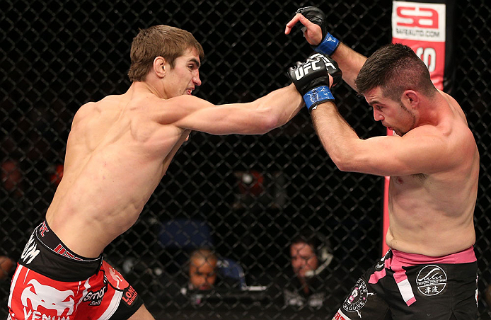 NOTTINGHAM, ENGLAND - SEPTEMBER 29: (L-R) John Hathaway punches John Maguire during their welterweight fight at the UFC on Fuel TV event at Capital FM Arena on September 29, 2012 in Nottingham, England. (Photo by Josh Hedges/Zuffa LLC/Zuffa LLC via Getty Images)