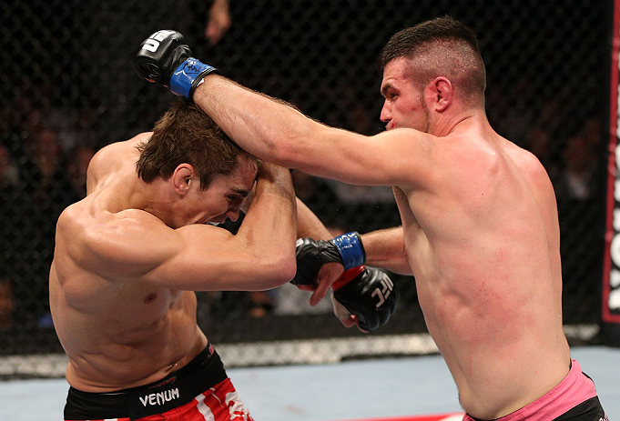 NOTTINGHAM, ENGLAND - SEPTEMBER 29: (R-L) John Maguire punches John Hathaway during their welterweight fight at the UFC on Fuel TV event at Capital FM Arena on September 29, 2012 in Nottingham, England. (Photo by Josh Hedges/Zuffa LLC/Zuffa LLC via Getty Images)