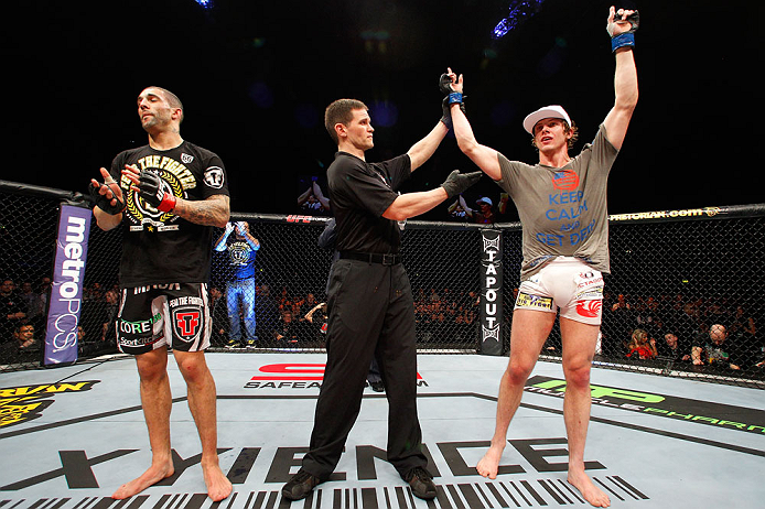 LONDON, ENGLAND - FEBRUARY 16: Matthew Riddle (R) reacts after defeating Che Mills (L) in their welterweight fight during the UFC on Fuel TV event on February 16, 2013 at Wembley Arena in London, England. (Photo by Josh Hedges/Zuffa LLC/Zuffa LLC via Getty Images)