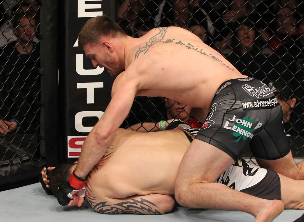 OMAHA, NE - FEBRUARY 15: (R-L) Stipe Miocic punches Phil De Fries during the UFC on FUEL TV event at Omaha Civic Auditorium on February 15, 2012 in Omaha, Nebraska. (Photo by Josh Hedges/Zuffa LLC/Zuffa LLC via Getty Images) *** Local Caption *** Stipe Miocic; Phil De Fries