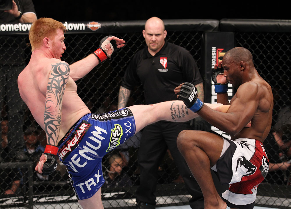 LAS VEGAS, NV - FEBRUARY 04:  Ed Herman (left) kicks Clifford Starks during the UFC 143 event at Mandalay Bay Events Center on February 4, 2012 in Las Vegas, Nevada.  (Photo by Nick Laham/Zuffa LLC/Zuffa LLC via Getty Images) *** Local Caption *** Ed Herman; Clifford Starks