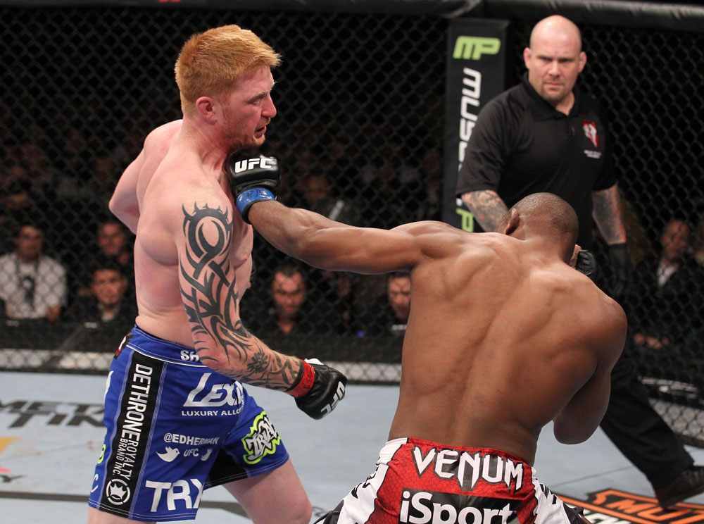 LAS VEGAS, NV - FEBRUARY 04:  Clifford Starks (right) punches Ed Herman during the UFC 143 event at Mandalay Bay Events Center on February 4, 2012 in Las Vegas, Nevada.  (Photo by Nick Laham/Zuffa LLC/Zuffa LLC via Getty Images) *** Local Caption *** Clifford Starks; Ed Herman