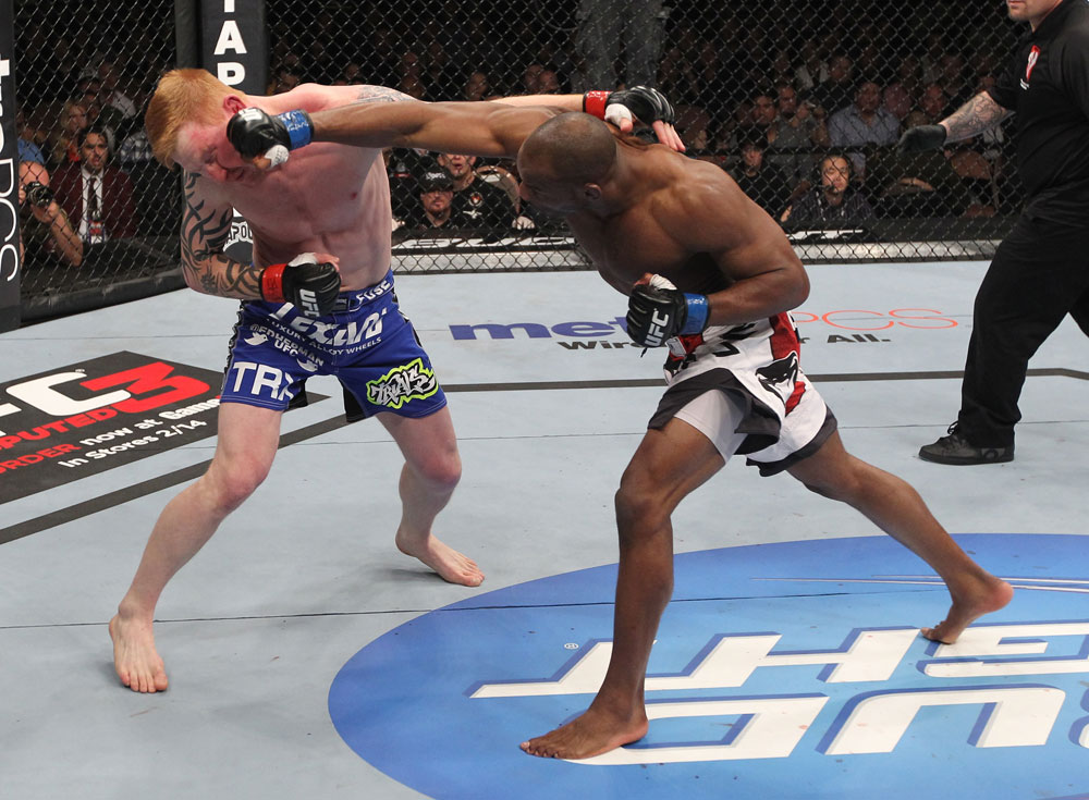 LAS VEGAS, NV - FEBRUARY 04:  (R-L) Clifford Starks punches Ed Herman during the UFC 143 event at Mandalay Bay Events Center on February 4, 2012 in Las Vegas, Nevada.  (Photo by Nick Laham/Zuffa LLC/Zuffa LLC via Getty Images) *** Local Caption *** Clifford Starks; Ed Herman