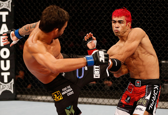 SAO PAULO, BRAZIL - JANUARY 19: (L-R) Milton Vieira kicks Godofredo "Pepey" Castro in their featherweight fight at the UFC on FX event on January 19, 2013 at Ibirapuera Gymnasium in Sao Paulo, Brazil. (Photo by Josh Hedges/Zuffa LLC/Zuffa LLC via Getty Images)