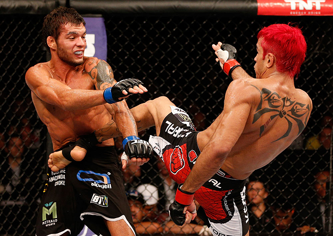 SAO PAULO, BRAZIL - JANUARY 19: (R-L) Godofredo "Pepey" Castro kicks Milton Vieira in their featherweight fight at the UFC on FX event on January 19, 2013 at Ibirapuera Gymnasium in Sao Paulo, Brazil. (Photo by Josh Hedges/Zuffa LLC/Zuffa LLC via Getty Images)