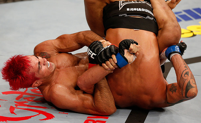 SAO PAULO, BRAZIL - JANUARY 19: (L-R) Godofredo "Pepey" Castro attempts a shoulder lock submission against Milton Vieira in their featherweight fight at the UFC on FX event on January 19, 2013 at Ibirapuera Gymnasium in Sao Paulo, Brazil. (Photo by Josh Hedges/Zuffa LLC/Zuffa LLC via Getty Images)