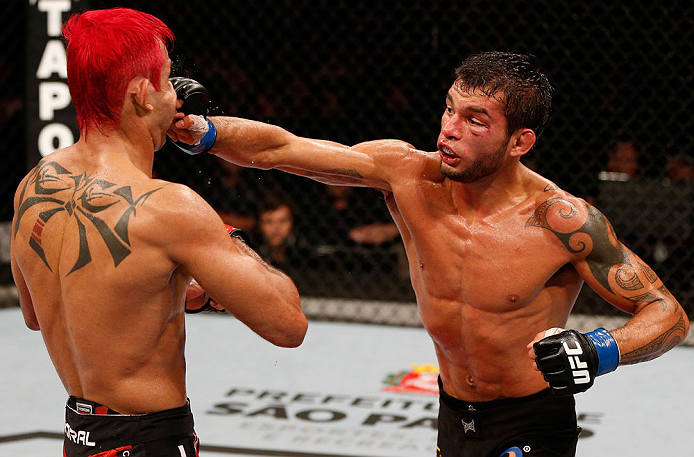 SAO PAULO, BRAZIL - JANUARY 19: (R-L) Milton Vieira punches Godofredo "Pepey" Castro in their featherweight fight at the UFC on FX event on January 19, 2013 at Ibirapuera Gymnasium in Sao Paulo, Brazil. (Photo by Josh Hedges/Zuffa LLC/Zuffa LLC via Getty Images)