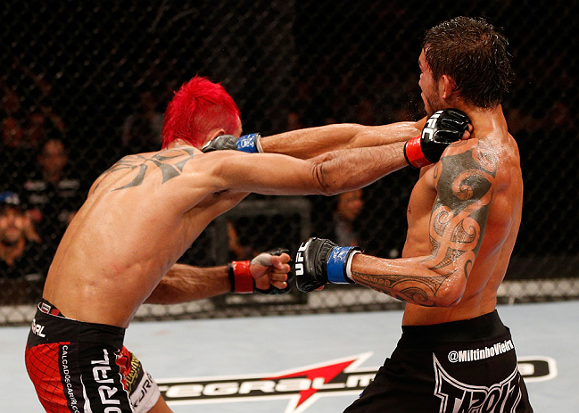 SAO PAULO, BRAZIL - JANUARY 19: (L-R) Godofredo "Pepey" Castro and Milton Vieira trade punches in their featherweight fight at the UFC on FX event on January 19, 2013 at Ibirapuera Gymnasium in Sao Paulo, Brazil. (Photo by Josh Hedges/Zuffa LLC/Zuffa LLC via Getty Images)