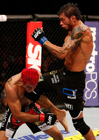 SAO PAULO, BRAZIL - JANUARY 19: (R-L) Milton Vieira delivers a flying knee against Godofredo "Pepey" Castro in their featherweight fight at the UFC on FX event on January 19, 2013 at Ibirapuera Gymnasium in Sao Paulo, Brazil. (Photo by Josh Hedges/Zuffa LLC/Zuffa LLC via Getty Images)