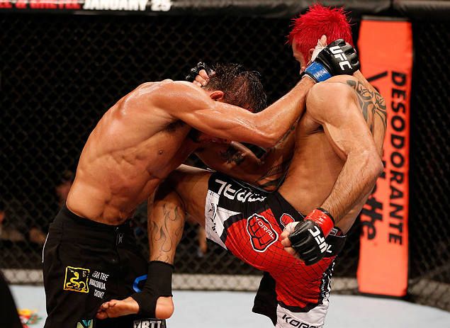 SAO PAULO, BRAZIL - JANUARY 19: (R-L) Godofredo "Pepey" Castro knees Milton Vieira in their featherweight fight at the UFC on FX event on January 19, 2013 at Ibirapuera Gymnasium in Sao Paulo, Brazil. (Photo by Josh Hedges/Zuffa LLC/Zuffa LLC via Getty Images)