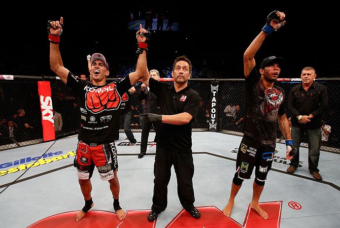 SAO PAULO, BRAZIL - JANUARY 19: Godofredo "Pepey" Castro (L) reacts after winning a split decision over Milton Vieira (R) in their featherweight fight at the UFC on FX event on January 19, 2013 at Ibirapuera Gymnasium in Sao Paulo, Brazil. (Photo by Josh Hedges/Zuffa LLC/Zuffa LLC via Getty Images)