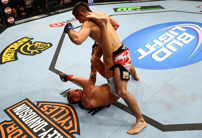 CHICAGO, IL - JANUARY 26:  Ricardo Lamas (Top) punches Erik Koch (Bottom) during their Featherweight Bout part of UFC on FOX at United Center on January 26, 2013 in Chicago, Illinois.  (Photo by Al Bello/Zuffa LLC/Zuffa LLC Via Getty Images)