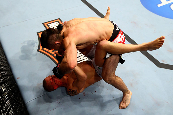 CHICAGO, IL - JANUARY 26:  Ricardo Lamas (Top) punches Erik Koch (Bottom) during their Featherweight Bout part of UFC on FOX at United Center on January 26, 2013 in Chicago, Illinois.  (Photo by Al Bello/Zuffa LLC/Zuffa LLC Via Getty Images)