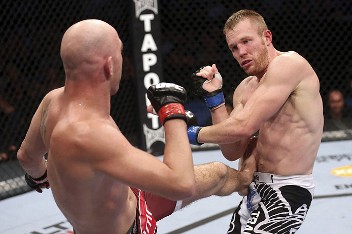 CALGARY, CANADA - JULY 21: (L-R) Brian Ebersole lands a kick at the body of James Head during their welterweight bout at UFC 149 inside the Scotiabank Saddledome on July 21, 2012 in Calgary, Alberta, Canada.  (Photo by Nick Laham/Zuffa LLC/Zuffa LLC via Getty Images)