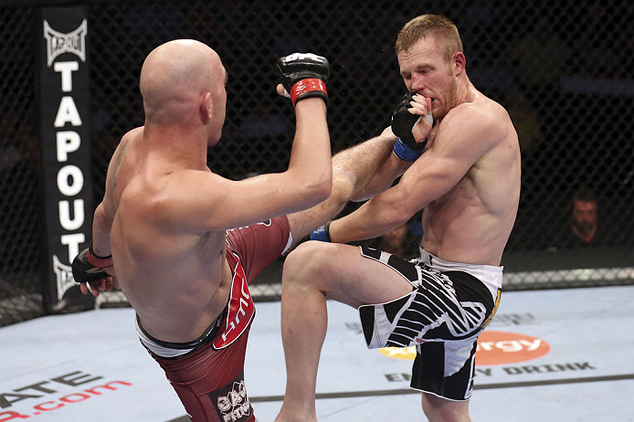 CALGARY, CANADA - JULY 21: (L-R) Brian Ebersole lands a kick to the body of James Head during their welterweight bout at UFC 149 inside the Scotiabank Saddledome on July 21, 2012 in Calgary, Alberta, Canada.  (Photo by Nick Laham/Zuffa LLC/Zuffa LLC via Getty Images)