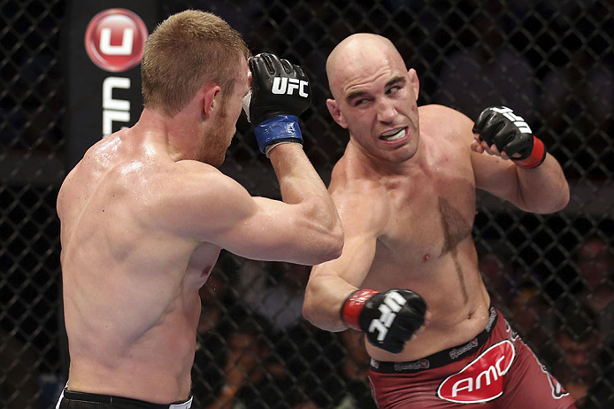 CALGARY, CANADA - JULY 21: (R-L) Brian Ebersole throws a punch at James Head during their welterweight bout at UFC 149 inside the Scotiabank Saddledome on July 21, 2012 in Calgary, Alberta, Canada.  (Photo by Nick Laham/Zuffa LLC/Zuffa LLC via Getty Images)