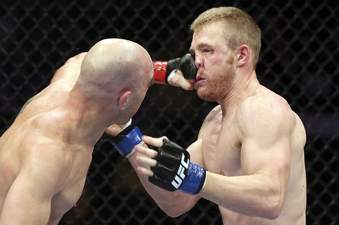 CALGARY, CANADA - JULY 21: (L-R) Brian Ebersole lands a punch on the face of James Head during their welterweight bout at UFC 149 inside the Scotiabank Saddledome on July 21, 2012 in Calgary, Alberta, Canada.  (Photo by Nick Laham/Zuffa LLC/Zuffa LLC via Getty Images)