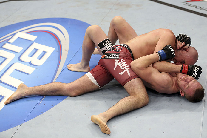 CALGARY, CANADA - JULY 21: (L-R) Brian Ebersole uses his body weight to get advantage of James Head during their welterweight bout at UFC 149 inside the Scotiabank Saddledome on July 21, 2012 in Calgary, Alberta, Canada.  (Photo by Nick Laham/Zuffa LLC/Zuffa LLC via Getty Images)