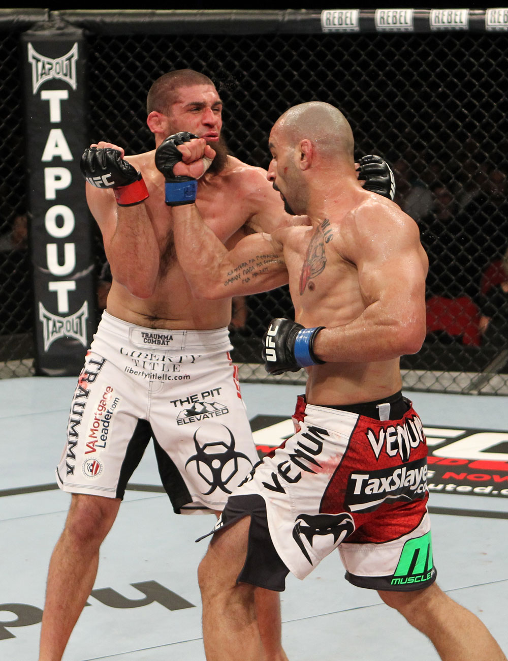 SYDNEY, AUSTRALIA - MARCH 03: (R-L) Constantinos Philippou punches Court McGee in a middleweight bout during the UFC on FX event at Allphones Arena on March 3, 2012 in Sydney, Australia. (Photo by Josh Hedges/Zuffa LLC/Zuffa LLC via Getty Images) *** Local Caption *** Court McGee; Constantinos Philippou
